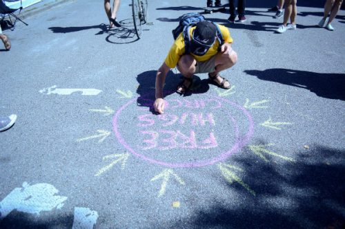chalk drawing free hugs circle on asphalt