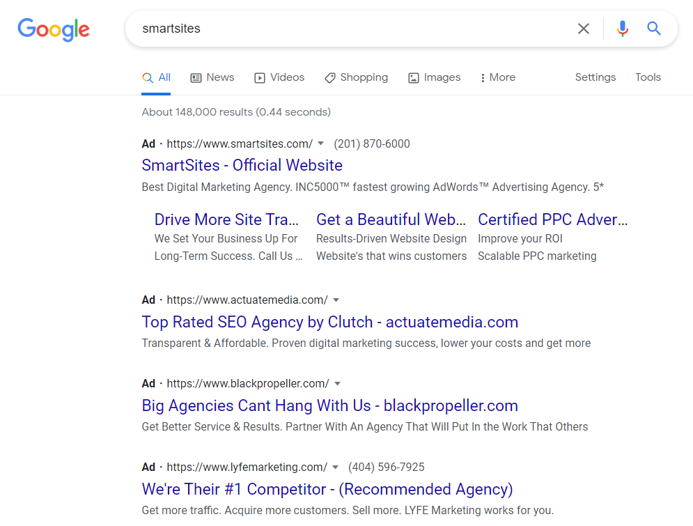 Three competitors bidding on SmartSites brand name in Google Ads