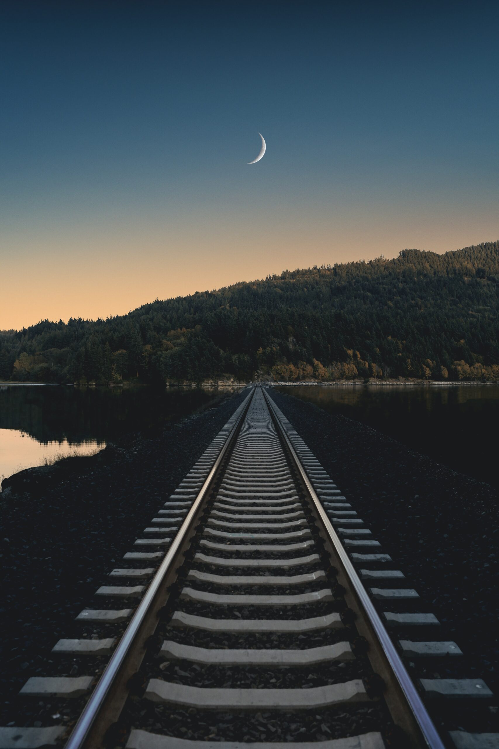 view of the moon from railroad tracks in the Chuckanut neighborhood